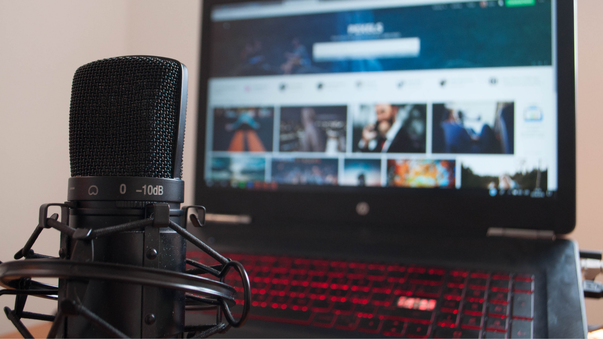 black microphone in front of laptop screen
